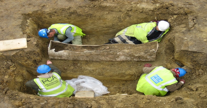 Archaeologists unearth a Roman lead-lined coffin. Image courtesy of Pre-Construct Archaeology